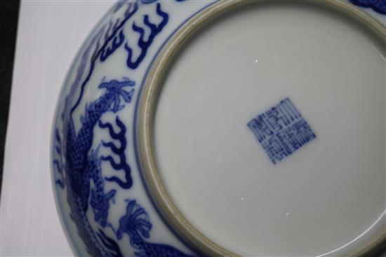 A Chinese blue and white dragon dish, diameter 16.3cm, some damage